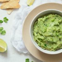 Chips & Guacamole · Delicious plate of Tortilla chips, served with a side of Guacamole in customer's preference ...