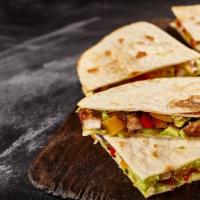 Super Quesadilla · Delicious quesadilla made with cheese, customer's choice of meat, lettuce, tomatoes, and sal...
