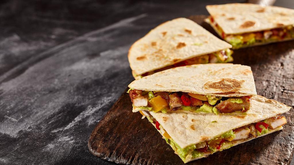 Super Quesadilla · Delicious quesadilla made with cheese, customer's choice of meat, lettuce, tomatoes, and salsa.