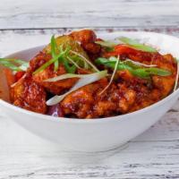 Chilli Chicken · Crispy marinated chicken sautéed in a spicy sweet sauce and cooked with onions, bell peppers...