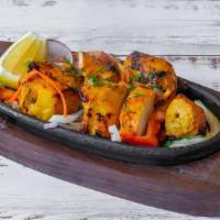 Chicken Tikka · Chicken marinated in yogurt and aromatic spices. Cooked in a clay oven.