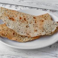 Papad · Papad is a dried lentil chip studded with Indian spices.