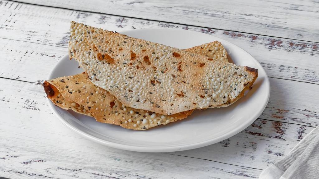 Papad · Papad is a dried lentil chip studded with Indian spices.