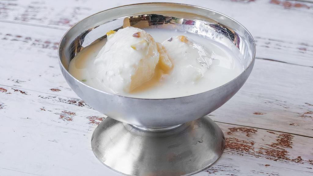 Rasmalai · Rasmalai is a popular Indian sweet of cottage cheese balls soaked in thickened, sweetened and flavored milk.