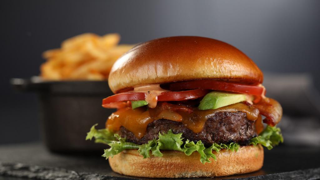 Blue Cheese Burger · Burger, cajun seasoning, blue cheese crumbles, lettuce tomato and House Sauce.