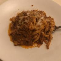Tagliatelle Alla Bolognese · Ribbon egg pasta with meat sauce.