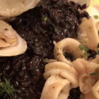Risotto Venere  Con Calamari E Vongole · Black rice braised with fish stock, calamari and clams.