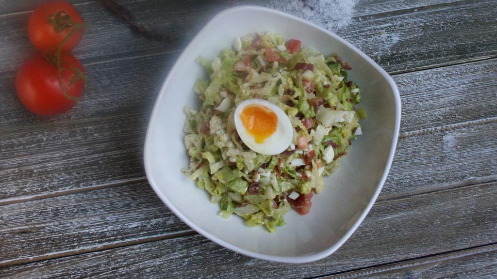 Cobb Salad · Mixed greens, applewood bacon, tomatoes, egg, avocado, crumbled blue cheese, honey lemon vinaigrette