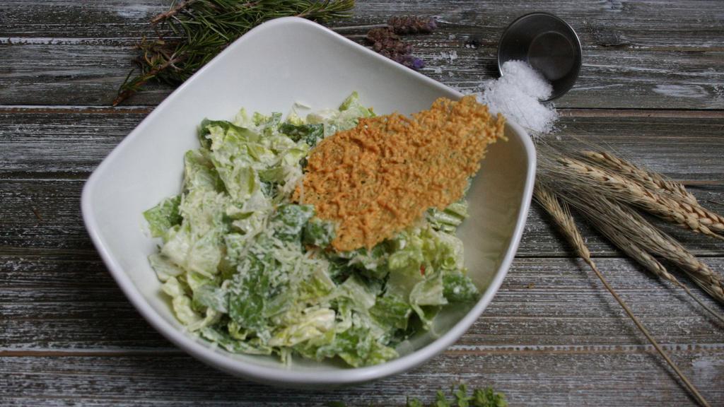 Caesar Salad · Housemade caesar dressing, baked croutons,  romaine, parmesan, anchovy.