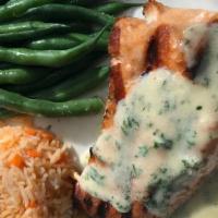 Grilled Atlantic Salmon · Grilled salmon filet with a lemon butter sauce served with mashed potatoes and spinach