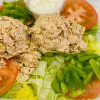 Tuna Salad · Tomatoes, bell peppers and tuna salad over a bed of lettuce.