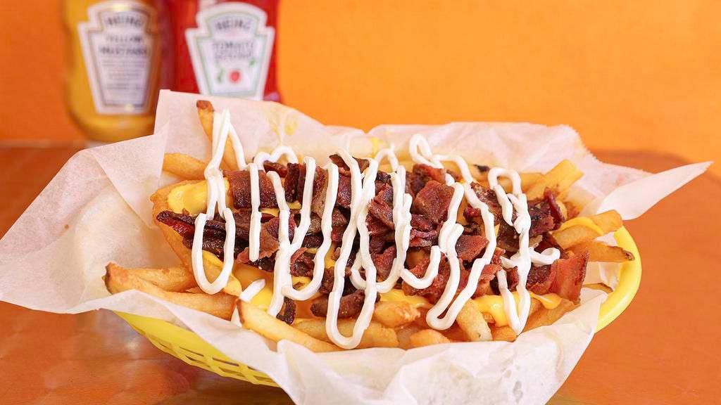 Loaded Fries · Cheese whiz, bacon, sour cream.