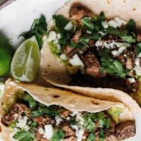 Street Tacos - 4 · Your favorite staple food. Choice of meat: al pastor or asada. Topped with cilantro, chopped...
