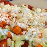 Enchiladas - 4 · Queso fresco and chopped crispy onions wrapped in a corn tortilla topped with lettuce, diced...