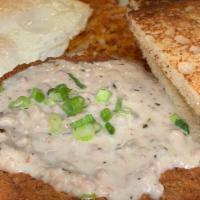 Country Fried Stk · CF Steak topped with homemade sausage gravy, 2 eggs any style, yukon gold hash browns and to...