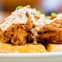 Chicken & Waffle · Belgian waffled topped with 4 pieces golden fried chicken topped with home made sausage grav...