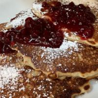 Oatmeal Pancakes · Gluten-Free.. stack of 3, made with whole oats & buttermilk topped with lingonberries and po...