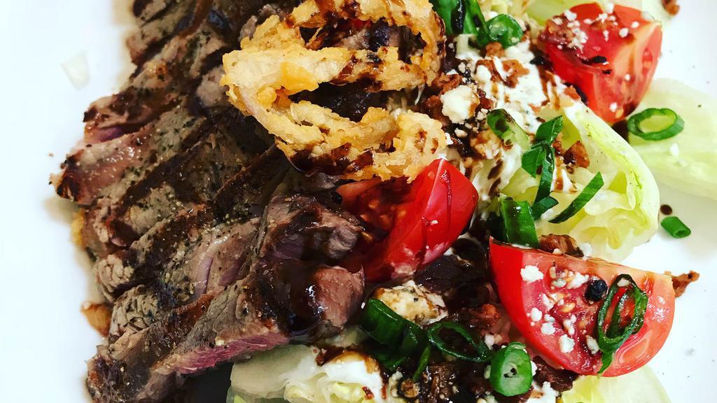 Wedge · choice NY steak, iceberg wedges, blue cheese crumbles, bacon, scallions, cherry tomatoes, fried shallots, balsamic reduction, blue cheese dressing 19.95