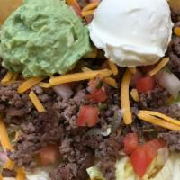 Taco Salad · ground beef or grilled chicken, lettuce, black beans, cheddar cheese, chunky salsa, guacamol...