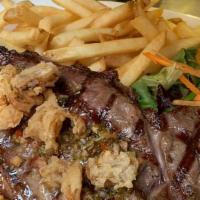 NY Steak · Upper Choice NY topped w/ chimichurri sauce, fried shallots, fries & salad