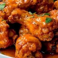 Chicken Wings · Chicken wings marinated in our special homemade brine -  with a choice of hot sauce.