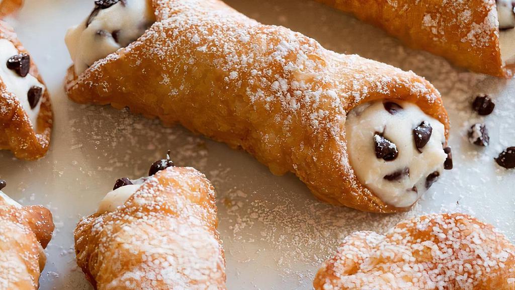 Cannoli ( 2 pc ) · Italian pastry - Tube-shaped shells of fried pastry dough, filled with sweet, creamy ricotta and chocolate chips
