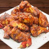 Hot Wings · Oven-roasted wings tossed in Frank’s® RedHot sauce. Served with a side of ranch dressing.
