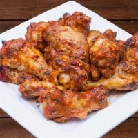 Sweet Chili Wings · Oven roasted wings tossed in sweet chili sauce. Served with a side of ranch dressing.