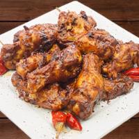 BBQ Wings · Oven-roasted wings tossed in Bull's Eye BBQ sauce. Served with a side of ranch dressing.