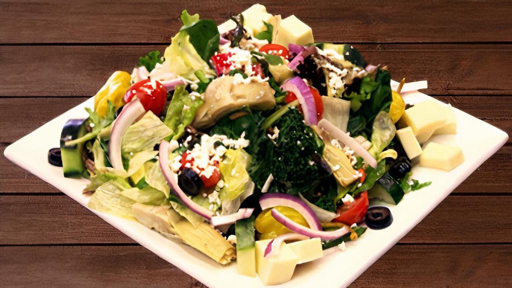 Greek Salad · Lettuce, tomatoes, onion, olives, cucumber, artichoke hearts, carrots, pepperoncini, and feta cheese.