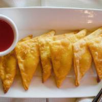 Fried Crab Meat Rangoon (6) · Fried wontons with crab meat cream cheese filling.