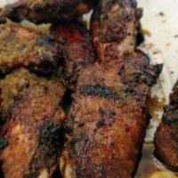 Jerk Chicken Wings · Marinated chicken wings grilled with Jerk dipping sauce.