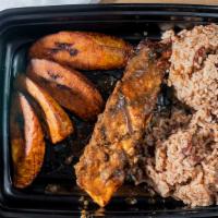Jerk Salmon · Marinated flame grilled salmon served with rice, beans and plantain