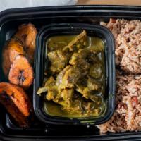Curried Goat · Jamaican delicacy, marinated and cooked tender (bone in) with island spices, served with ric...