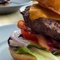 SPRO Burger · Vegan. Sharp Cheddar, sirloin, lettuce, tomato, pickles, smoked guava rum sauce, toasted bri...
