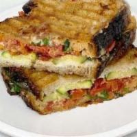 Vegetarian Panini · Emmental, eggplant, zucchini, piquillo peppers, garlic aioli on homemade sourdough bread. In...