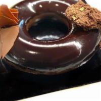 Chocolate Imperial Cake · with caramel chocolate mousse and a crème brûlée insert.  Feeds 6-8 people. 

*Contains Almo...