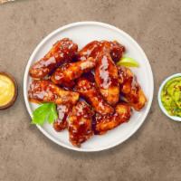 BBQ Chicken Wings · Fresh chicken wings breaded, fried until golden brown, and tossed in barbecue sauce. Served ...