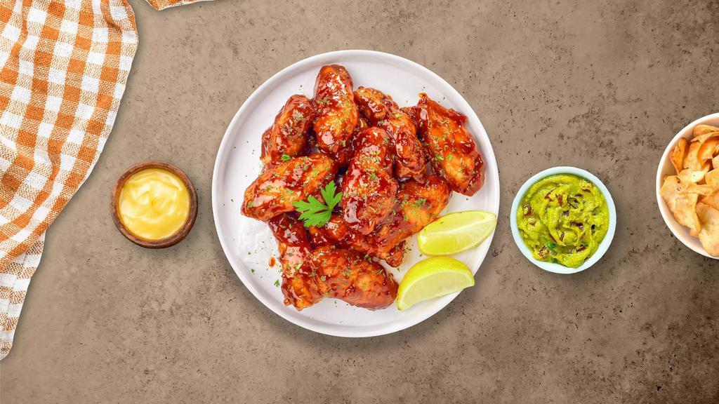 Honey BBQ Wings · Fresh chicken wings breaded, fried until golden brown, and tossed in honey and barbecue sauce. Served with your choice of dipping sauce.