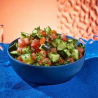 Tomato Cucumber Salad · Diced tomatoes, onions, and cucumbers with parsley and olive oil.