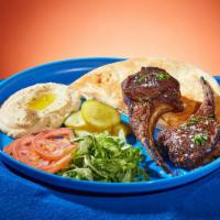 Lamb Chops Platter · Marinated and grilled lamb chops. Served with rice or hummus, lettuce, tomato, pickles, and ...