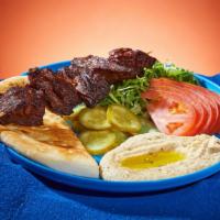 Beef Kebab Platter · Marinated cubes of beef grilled on a skewer. Served with rice, lettuce, tomato, pickles, and...