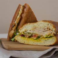 Turkey Sandwich · Smoked turkey breast, swiss cheese, avocado, jalapenos, red onion, pesto, house balsamic, le...