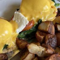 Florentine Benedict · Feta cheese, real fresh tomatoes wilted the spinach.