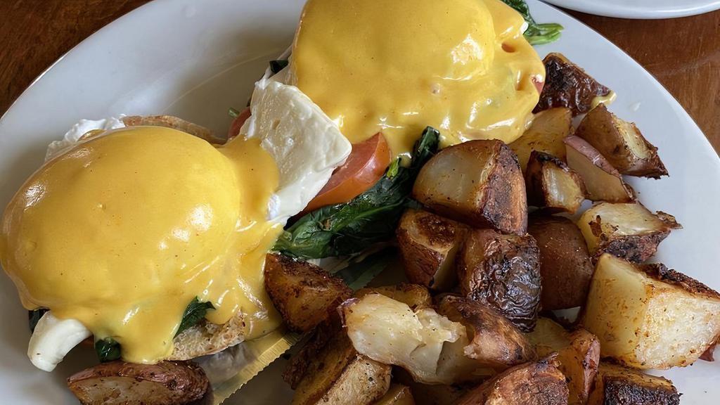 Florentine Benedict · Feta cheese, real fresh tomatoes wilted the spinach.