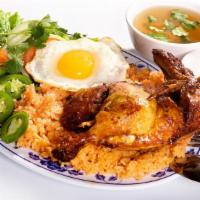 41. Cơm Chiên Gà Rô Ti · Vietnamese Style Roti Chicken with red rice and an egg