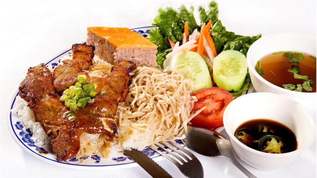 39. Cơm Tấm Bì  Trứng Chiên Sườn Nướng · Bbq Pork Chop served with shredded pork, fried egg, & steamed rice.