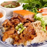38. Cơm Tấm Bì Trứng Chiên Thịt Nướng   · BBQ Pork served with shredded pork, fried egg, & steamed rice.