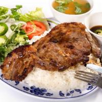 42. Cơm Thịt Bò Bít Tết /  New York Steak · Beef New York Steak served with steamed rice.