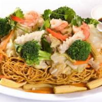 59. Mì Xào Dòn Thập Cẩm · Crispy egg noodles served with stir fry vegetables, shrimp, chicken, pork, and squid.